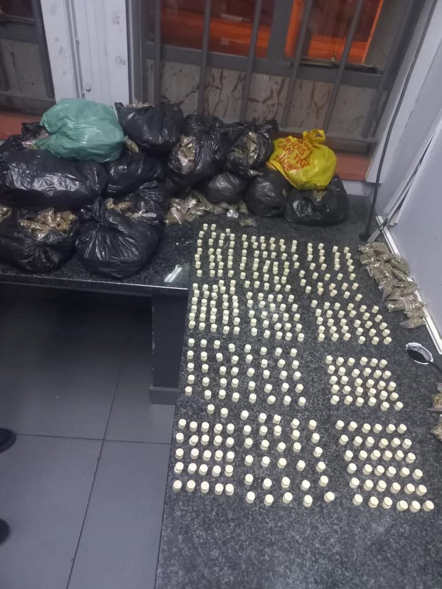 Suspect Held in Drug Raid